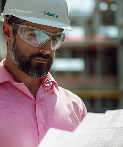 Three Solavita hybrid inverters floating above a futuristic dark landscape