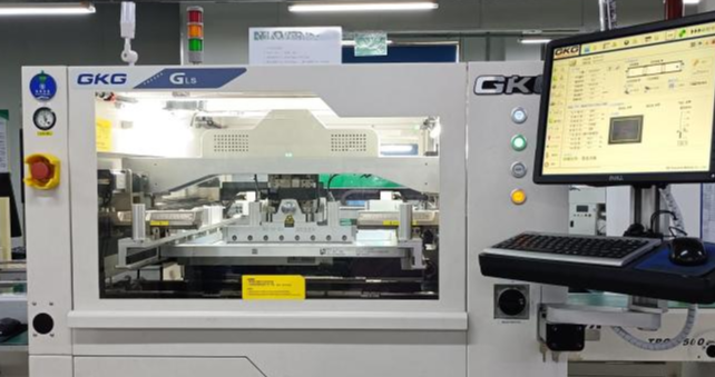 Automated stencil printing machine in a smart manufacturing line, used for precise solder paste application in PCB assembly.、
