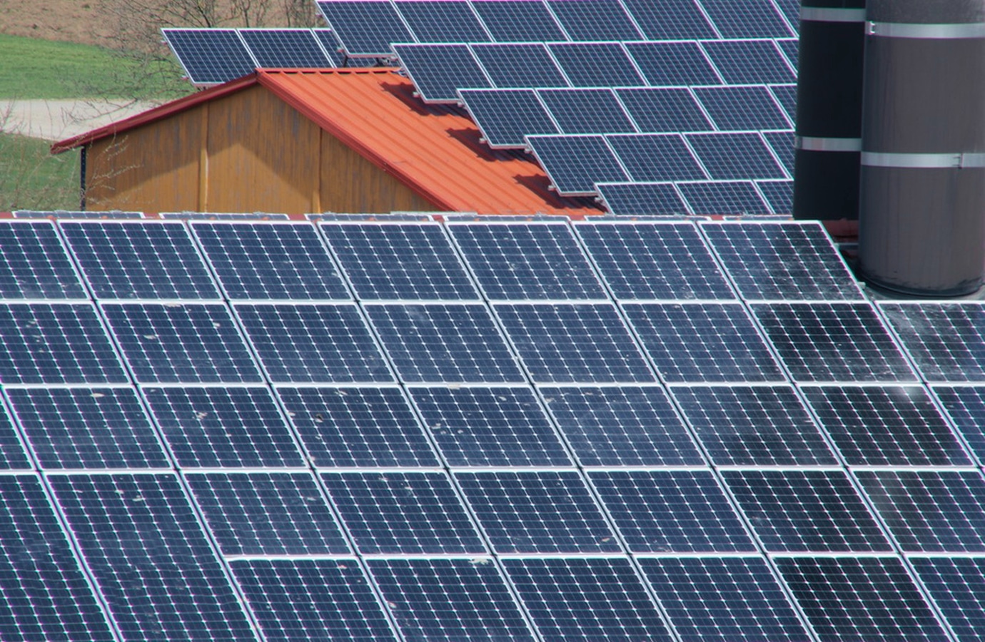 Close-up view of solar panels installed on rooftops, showcasing renewable energy generation.